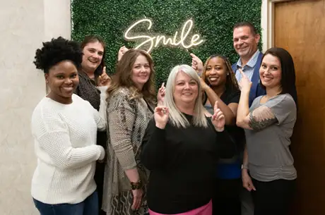 The team at Dr. Russell's Smile Studio having fun with their poses